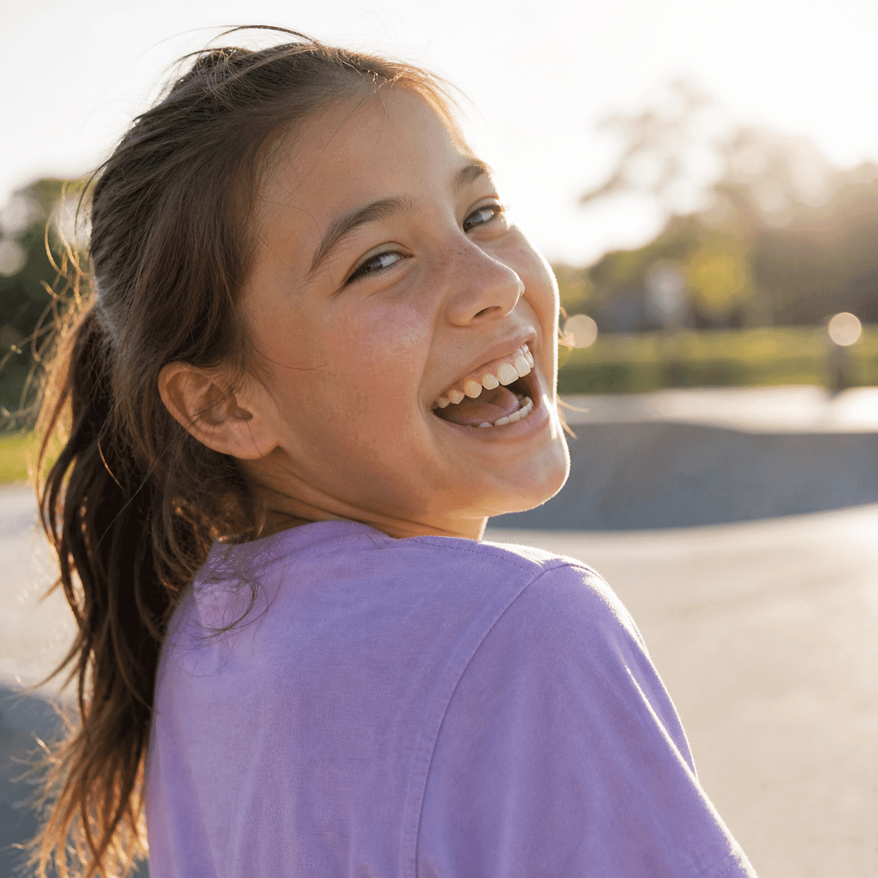 Canadian kid laughing freely after dental sealants applied at A Dental Office in Barrie, Ontario
